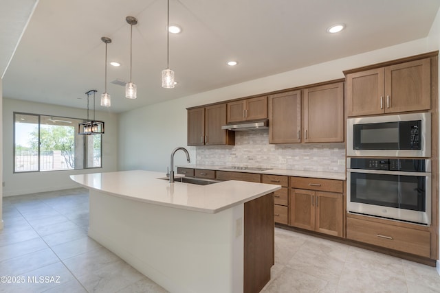 2559 E Wrightson View Dr, Green Valley, AZ 85614 - kitchen featuring stainless steel oven, a sink, built in microwave, black electric stovetop, and tasteful backsplash