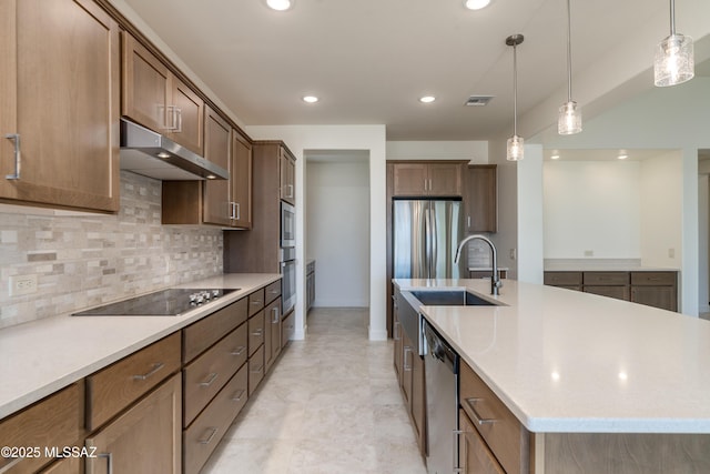 2559 E Wrightson View Dr, Green Valley, AZ 85614 - kitchen featuring appliances with stainless steel finishes, under cabinet range hood, a sink, backsplash, and a kitchen island with sink