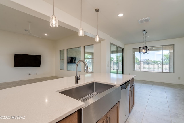 2559 E Wrightson View Dr, Green Valley, AZ 85614 - kitchen with open floor plan, stainless steel dishwasher, a sink, light countertops, and recessed lighting