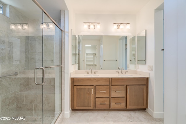 2559 E Wrightson View Dr, Green Valley, AZ 85614 - full bathroom with a shower stall, double vanity, and baseboards