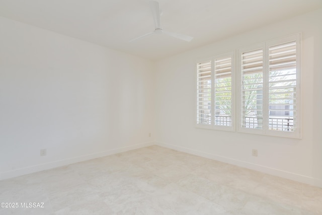 2559 E Wrightson View Dr, Green Valley, AZ 85614 - spare room featuring a ceiling fan and baseboards