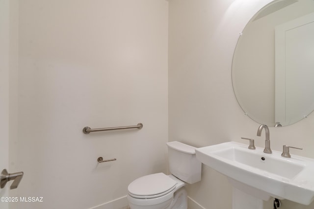 2559 E Wrightson View Dr, Green Valley, AZ 85614 - half bath with baseboards, a sink, and toilet