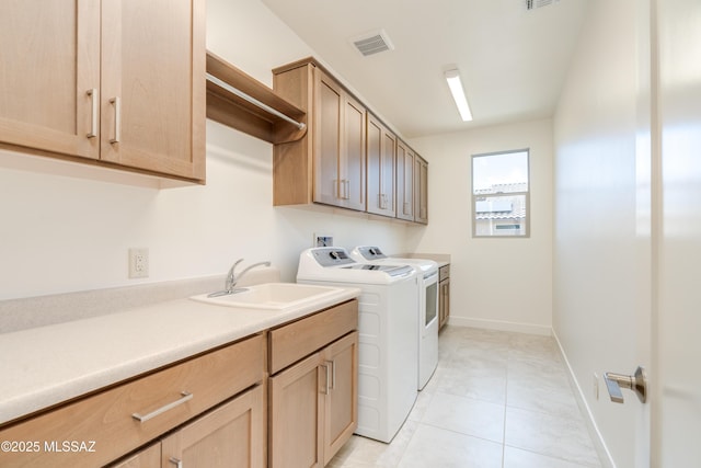 2559 E Wrightson View Dr, Green Valley, AZ 85614 - washroom featuring cabinet space, separate washer and dryer, light tile patterned flooring, and baseboards