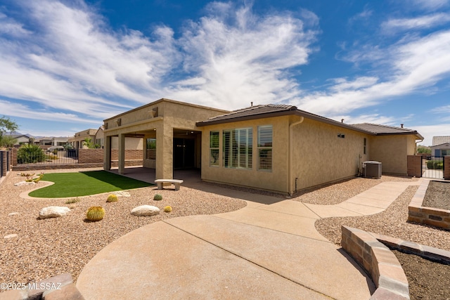 2559 E Wrightson View Dr, Green Valley, AZ 85614 - rear view of house featuring a patio, central AC, stucco siding, and a fenced backyard