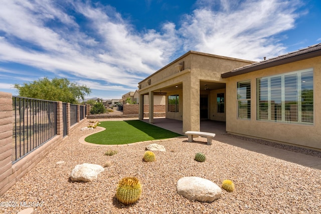 2559 E Wrightson View Dr, Green Valley, AZ 85614 - fenced backyard with a patio