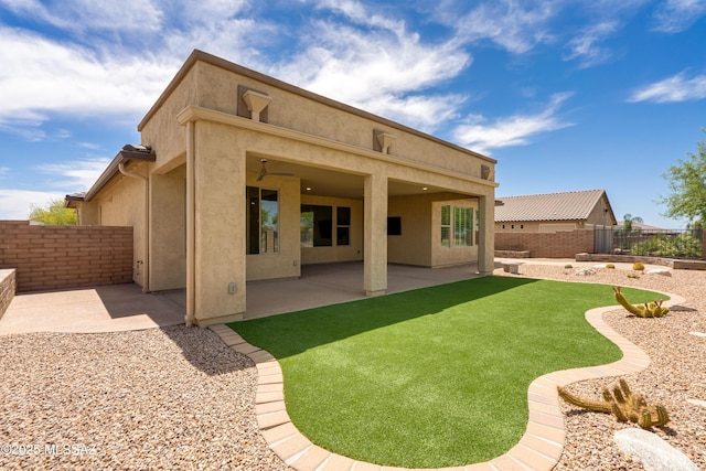 2559 E Wrightson View Dr, Green Valley, AZ 85614 - back of house featuring stucco siding and a patio