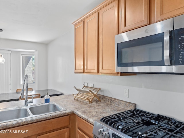 4801 E Canary Grass Dr, Tucson, AZ 85756 - kitchen with stainless steel appliances, a sink, and hanging light fixtures