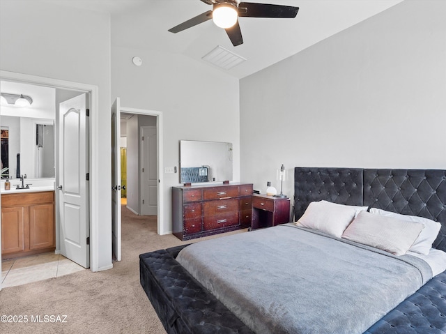 4801 E Canary Grass Dr, Tucson, AZ 85756 - bedroom with light colored carpet, a sink, ceiling fan, high vaulted ceiling, and connected bathroom