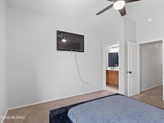 4801 E Canary Grass Dr, Tucson, AZ 85756 - bedroom featuring light carpet, baseboards, ensuite bathroom, and ceiling fan