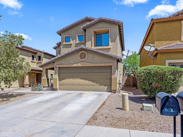 4801 E Canary Grass Dr, Tucson, AZ 85756 - view of front facade with concrete driveway, stucco siding, a tiled roof, and a garage