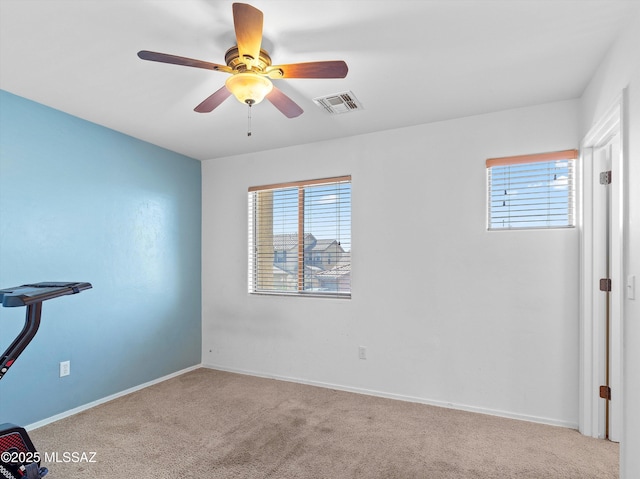 4801 E Canary Grass Dr, Tucson, AZ 85756 - unfurnished bedroom with multiple windows, carpet, baseboards, and a ceiling fan