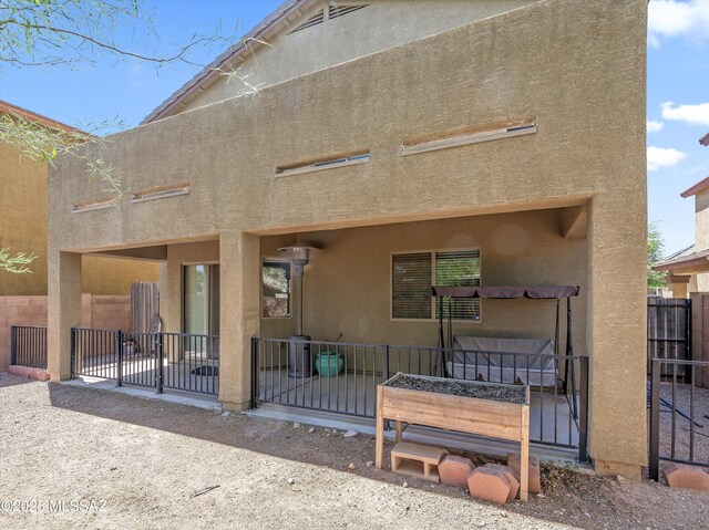 4801 E Canary Grass Dr, Tucson, AZ 85756 - rear view of house with stucco siding, fence, and a patio area