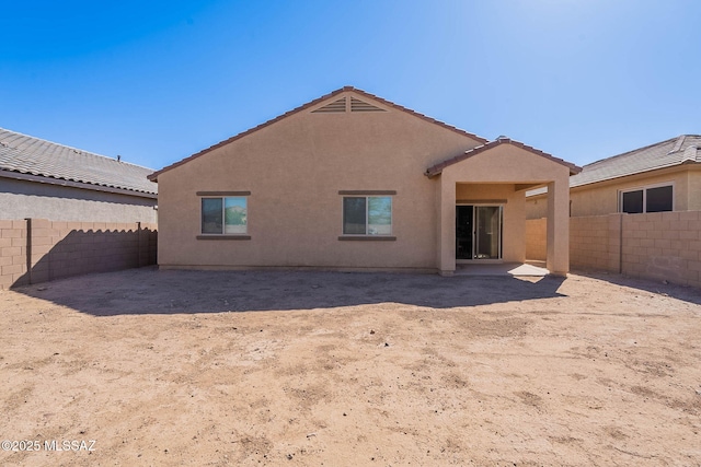 12622 N Wildrose Dr, Marana, AZ 85653 - rear view of property with a fenced backyard, stucco siding, and a tile roof