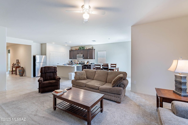 12622 N Wildrose Dr, Marana, AZ 85653 - living room featuring light carpet, a ceiling fan, recessed lighting, and baseboards