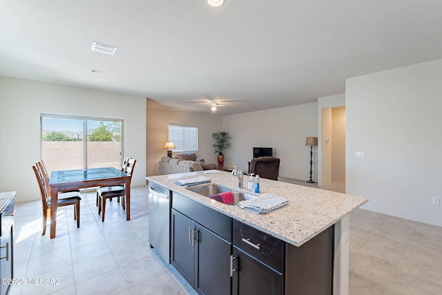 12622 N Wildrose Dr, Marana, AZ 85653 - kitchen with dishwasher, a sink, a ceiling fan, open floor plan, and a kitchen island with sink