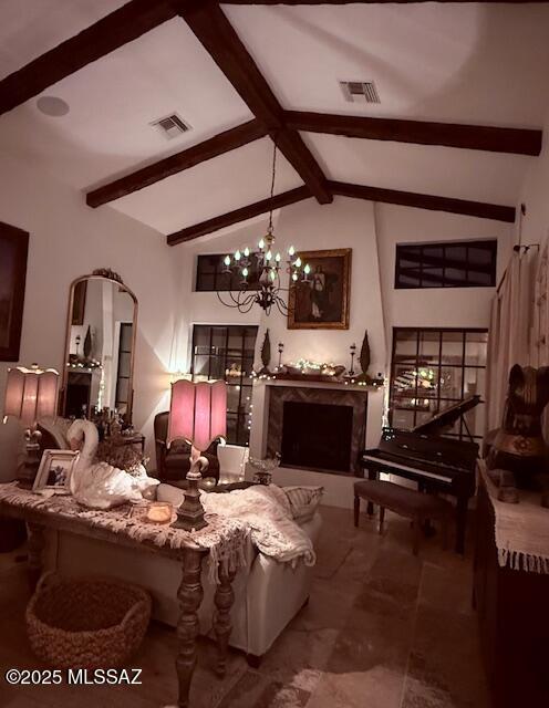 7774 E Cleary Way, Tucson, AZ 85715 - living area with a chandelier, arched walkways, and a premium fireplace