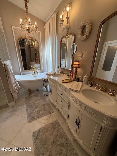 7774 E Cleary Way, Tucson, AZ 85715 - full bathroom featuring a freestanding bath, lofted ceiling, double vanity, and a chandelier