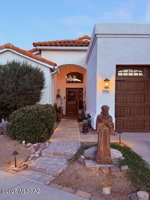 7774 E Cleary Way, Tucson, AZ 85715 - entrance to property featuring stucco siding, a tiled roof, and an attached garage