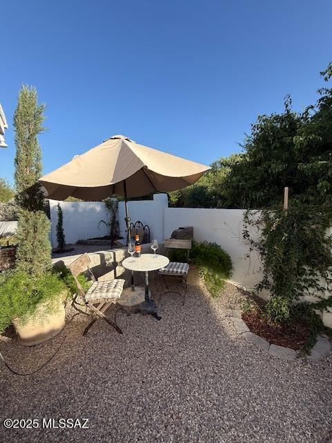 7774 E Cleary Way, Tucson, AZ 85715 - fenced backyard featuring a patio