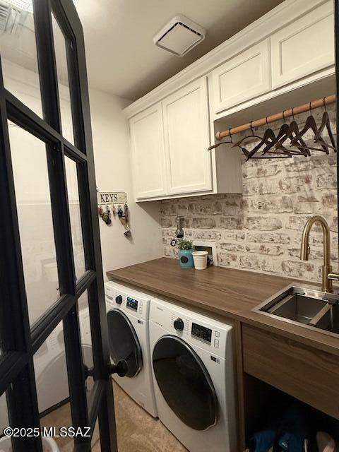7774 E Cleary Way, Tucson, AZ 85715 - laundry area with cabinet space and washing machine and dryer