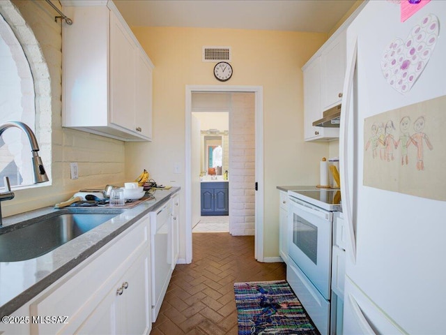 641 W Las Lomitas Rd, Tucson, AZ 85704 - kitchen featuring white appliances, a sink, brick flooring, and white cabinetry