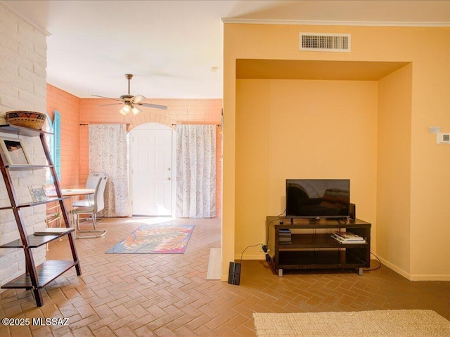 641 W Las Lomitas Rd, Tucson, AZ 85704 - living area with ceiling fan, baseboards, and brick patterned floors