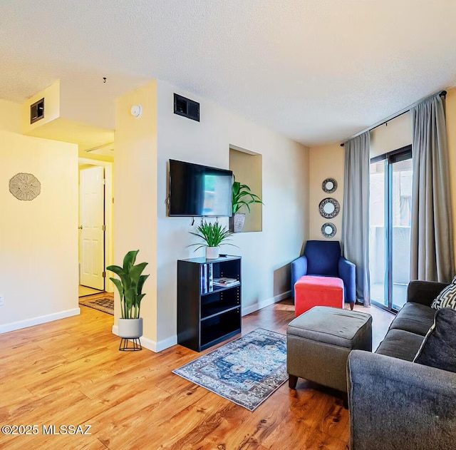 1745 E Glenn St Unit 133, Tucson, AZ 85719 - living area with wood finished floors and baseboards