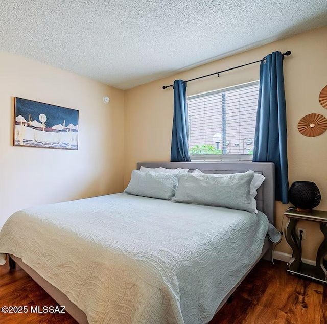 1745 E Glenn St Unit 133, Tucson, AZ 85719 - bedroom with wood finished floors and a textured ceiling