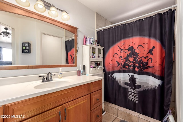 bathroom with vanity, tile patterned flooring, and curtained shower