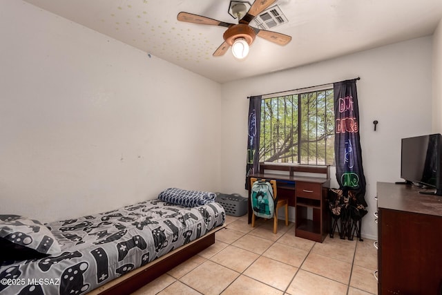 bedroom with light tile patterned floors and ceiling fan