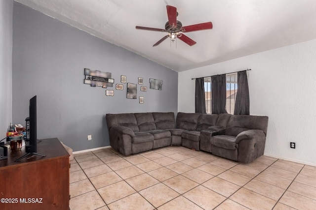 living room featuring vaulted ceiling, a ceiling fan, light tile patterned flooring, and baseboards