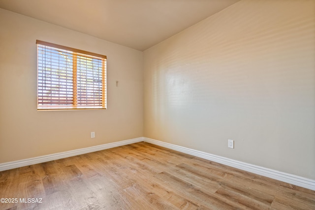 2002 E Pinon Dr, Tucson, AZ 85706 - unfurnished room with wood finished floors and baseboards
