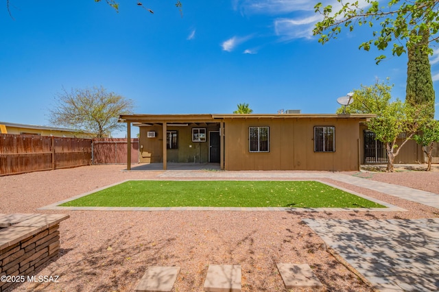 2002 E Pinon Dr, Tucson, AZ 85706 - back of house featuring a patio