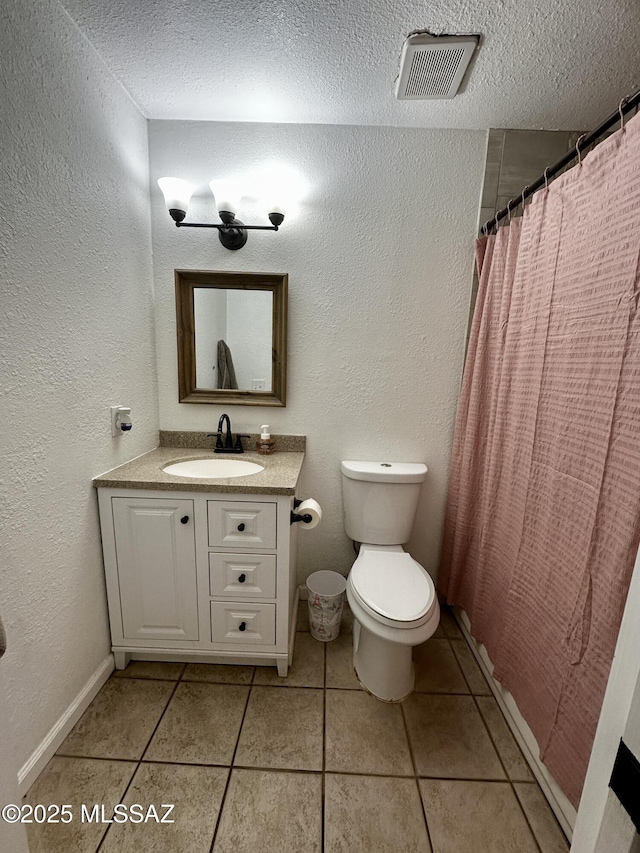 1609 S 12th Ave, Safford, AZ 85546 - full bathroom featuring tile patterned floors, a textured ceiling, vanity, toilet, and a shower with shower curtain