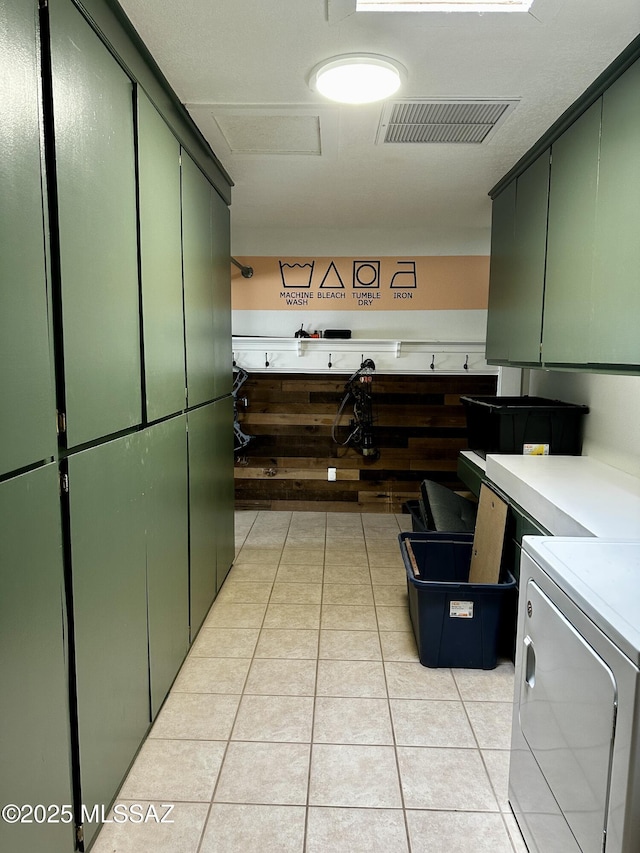 1609 S 12th Ave, Safford, AZ 85546 - clothes washing area with cabinet space, light tile patterned floors, and washer / clothes dryer
