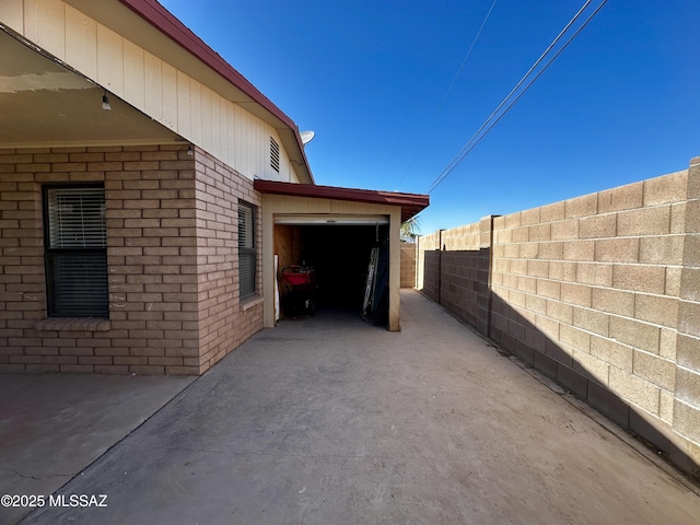 1609 S 12th Ave, Safford, AZ 85546 - view of patio with fence, a garage, and driveway