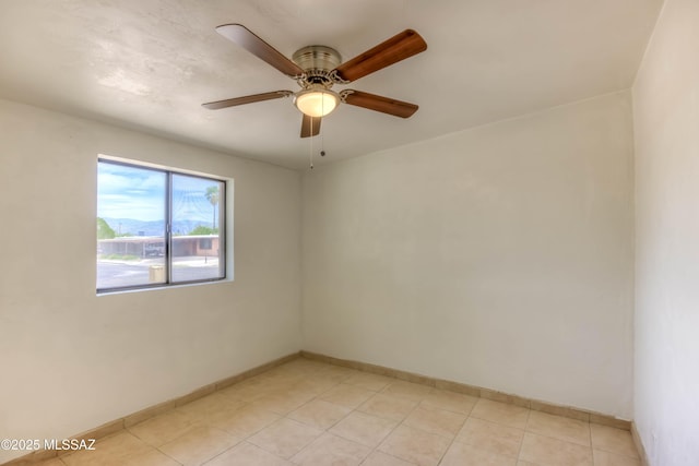 4842 E 27th St, Tucson, AZ 85711 - empty room featuring a ceiling fan and baseboards