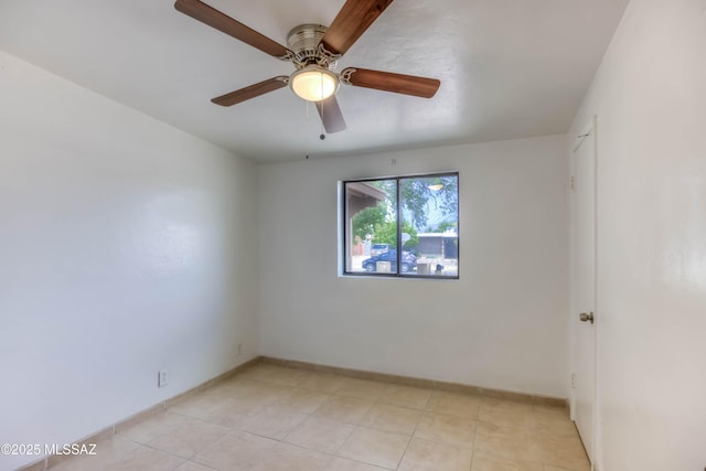 4842 E 27th St, Tucson, AZ 85711 - empty room with a ceiling fan, baseboards, and light tile patterned flooring