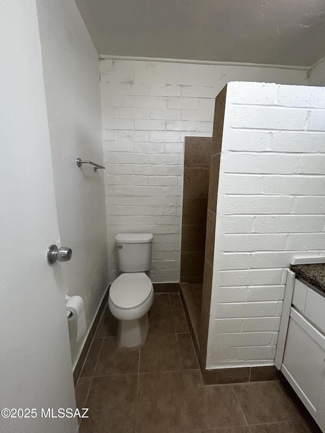 139 E 35th St, Tucson, AZ 85713 - bathroom featuring toilet, tile patterned flooring, vanity, and baseboards