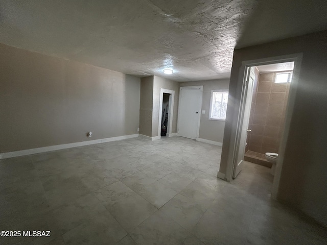 139 E 35th St, Tucson, AZ 85713 - below grade area featuring baseboards
