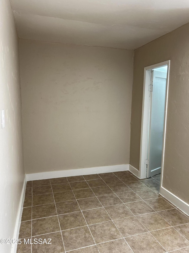 139 E 35th St, Tucson, AZ 85713 - empty room with tile patterned floors and baseboards