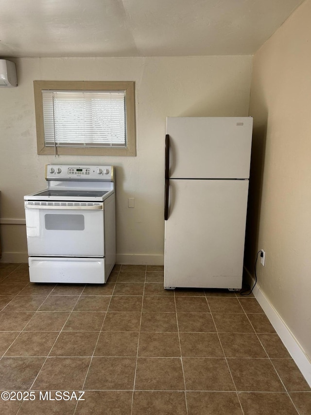 139 E 35th St, Tucson, AZ 85713 - kitchen featuring white appliances, an AC wall unit, dark tile patterned flooring, and baseboards