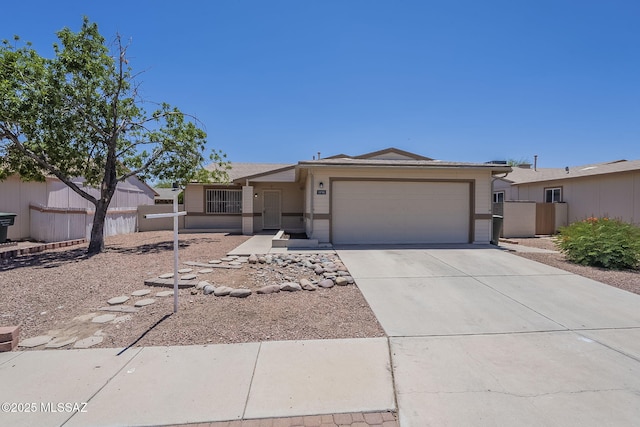 1741 W Maplewood Dr, Tucson, AZ 85746 - ranch-style house with an attached garage and driveway
