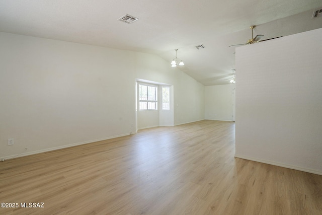 1741 W Maplewood Dr, Tucson, AZ 85746 - spare room with a ceiling fan, a chandelier, lofted ceiling, light wood-style floors, and baseboards