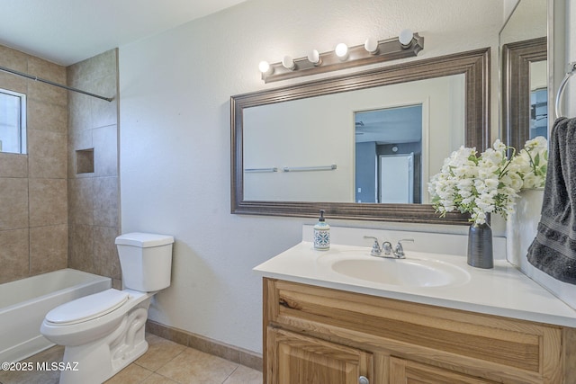 1741 W Maplewood Dr, Tucson, AZ 85746 - bathroom featuring vanity, tile patterned floors, toilet, washtub / shower combination, and baseboards