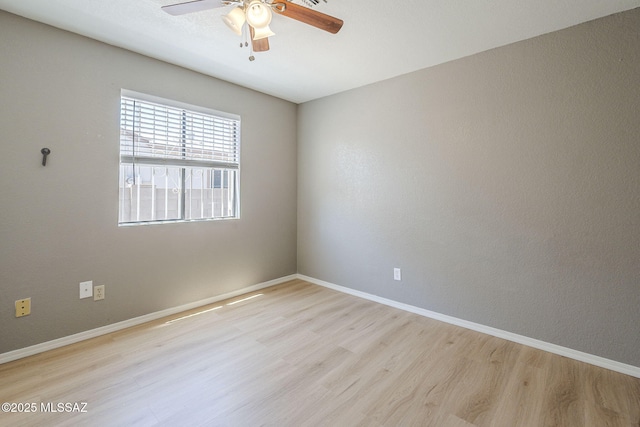1741 W Maplewood Dr, Tucson, AZ 85746 - unfurnished room with a ceiling fan, light wood-type flooring, and baseboards