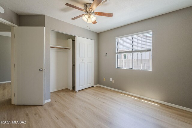 1741 W Maplewood Dr, Tucson, AZ 85746 - unfurnished bedroom with light wood-type flooring, a closet, and baseboards