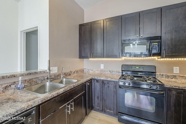 1741 W Maplewood Dr, Tucson, AZ 85746 - kitchen with black appliances, a sink, and light wood-type flooring