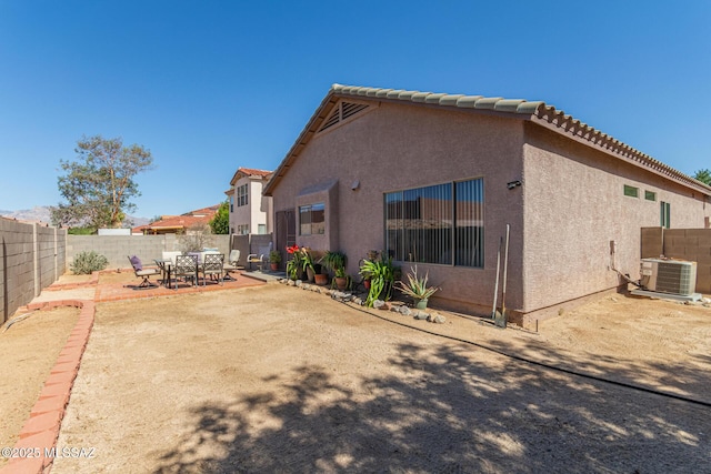 5608 Shady Grove, Tucson, AZ 85742 - rear view of house with a fenced backyard, central air condition unit, stucco siding, a patio, and a tile roof