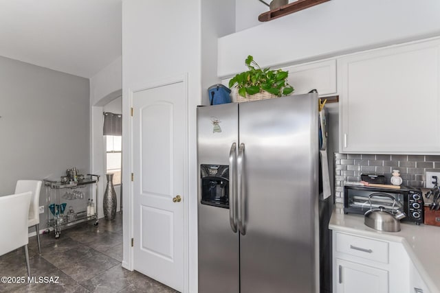 5608 Shady Grove, Tucson, AZ 85742 - kitchen featuring stainless steel fridge, white cabinets, decorative backsplash, and light countertops